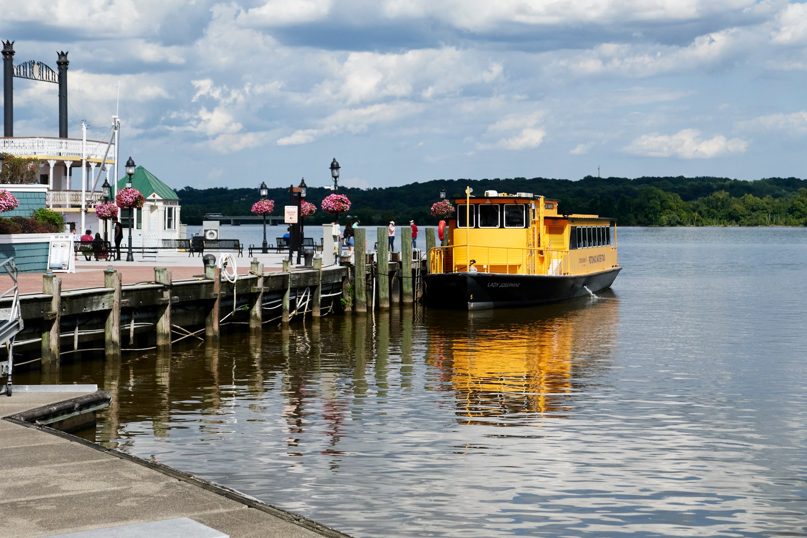 A bright yellow Potomac River taxi pulled up to the dock at Alexandria's waterfront